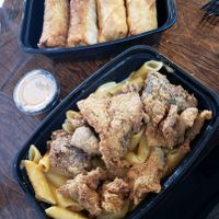 Mac n cheeze with fried chkn  and cheeze steak egg rolls at Vegan Bodega in New Britain