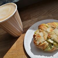 Pistachio bun and Caffè latte with oat milk at Gateau - Kaivokatu in Helsinki