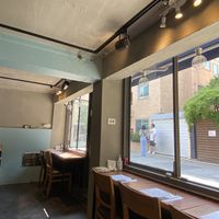 Super cute fixtures (zoom in on that little table and chairs hanging from the ceiling!)  I loved the open windows.   at Mothers Table in Seoul