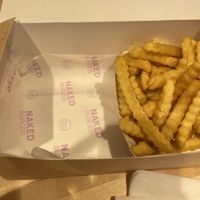 Box where the fries and burger are   at Naked Burger - 6ème in Paris