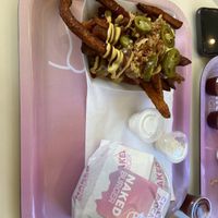 Sweet potato loaded fries with a chicken avacado and bacon burger. The nicest vegan burger I have ever had!  at Naked Burger - 6ème in Paris