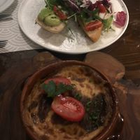 Vegan moussaka and avocado purée with on toast at Oskars in Kefalonia