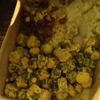 Part of sample platter including fried okra and mash at Souley Vegan in San Francisco