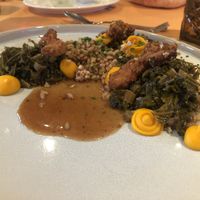 Fried king oyster mushrooms over greens and covered with gravy at Strandhotel Restaurant in Weissensee