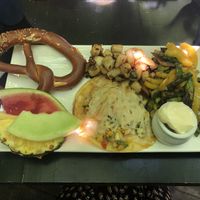 Vegan cheese with Tortillas, Pico de Gallo, fried potatoes and fresh & local veggies and a freshly baked pretzel at Bagel St-Henri in Montreal