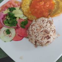 Meal of the day: salad, rice mixture and mashed plantain with tomato sauce at La Mesa Vegetariana in Bogota
