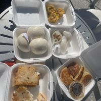 (Left top) egg custard buns, (below) turnip cake, (top right) siu mai, mixed mushroom dumpling, pan fried pork dumpling  at Chef Kenny's Vegan Dim Sum in Las Vegas