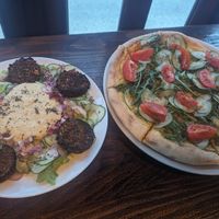 Falafel salad and arabiata pizza at Darkwood - Craft Beer Garden Imaimoze in Mostar