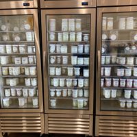 Freezer filled with pints in glass jars at Ginger's Divine Ice Creams in Los Angeles