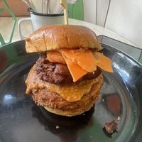 Signature Crispy No Frickin Chicken, Butta ‘Chicken’ Sauce, Bhaji, Mango Chutney & Pickled Carrot in a Brioche-Style Bun  at No Frickin Chicken in Worcester