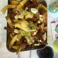 Loaded fries. Facon steam strips and pop corn no chicken   at No Frickin Chicken in Worcester