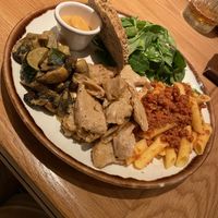 Market food with no chicken, mushroom curry, and vegan pasta bolognese.   at Margarito in Valencia