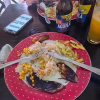 Veggie plate half eaten lol sorry. But eggplant, coconut rice, corn, avo salad and plantain. at Mama-Nilma in Cartagena