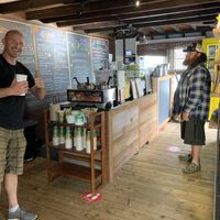 Owner Matthew on the left. Juice bar offering with grass and many different juices and smoothies, all organic   at Feelin O2 Good in Southampton