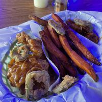 Wings with Asian zest sauce and the Garlic chili sauce on the right  at Café 420 in Oklahoma City