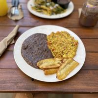 Scrambled eggs with beans and banana  at Crush in Merida