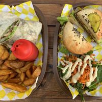 Mexican Wrap and potatoes (l); Mood Mex burger and salad (r). at Crush in Merida