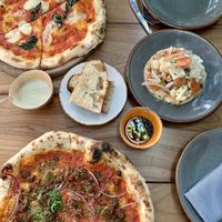 Margarita pizza, beyond meat pizza and the pickled veggie appetizer  at Pizza Papi in Tulum