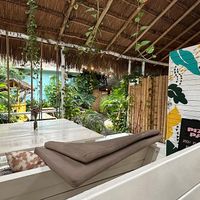 Shaded outdoor dining area  at Pizza Papi in Tulum