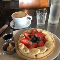 Waffles with fruit and latte at Freesoulcaffe in Tustin