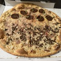 Half pepperoni and green pepper, half sausage and mushroom with vegan cheese  at Dante's Pizzeria in Chicago