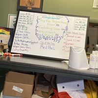 Daily menu written on a dry board  at Vegetarian Delight in Miramar