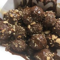 Praline, dulce de leche and salted almonds loukoumades at Keenkies in Athens