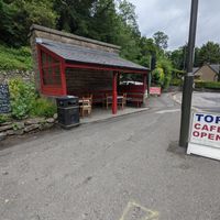 More outside seating, covered. It's the old bus stop. at The Tor Cafe in Cromford