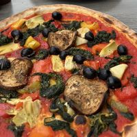 Vegetarian pizza no cheese.. they offered to add something so I added olives  at Luna Piccante in Wilderswil