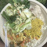 Lentil stew, tofu curry w/ veggies, salad and almond dressing, rice and pineapple dessert    at Krishna Lunch in Gainesville