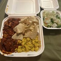 BBQ tofu, vegan Mac, tortilla chips, & salad. Normally comes with cinnamon apple desert but I’m allergic to cinnamon so none for me. (Wednesday menu)  at Krishna Lunch in Gainesville