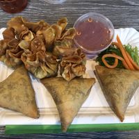 6 Fried wonton: wheat, soy, sesame; filling shiitake mushroom, vegetables, soy protein. 3 fried wonton: wheat: potato, carrot, peas, onion, wheat and curry powder.   at EatHappy Vegan in Oslo