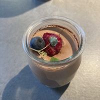 Their vegan chocolate mousse with raspberries and mudcake at the bottom. So good! #Veganuary at Henrys Bageri in Lidkoeping