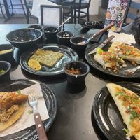 Our table stocked full of salsas and toppings  at Los Paradise in Playa Del Carmen