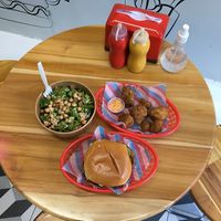 Super veggie burger, popcorn cauliflower, and kale + garbanzo salad 🤤  at Bob & Sue in Medellin