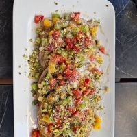 Vegan pancakes with fruits, coconut, peanut butter and maple syrup at Bakery Kafeneio in Limassol