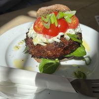 Vegan Bruin broodje Spruitjesburger met citroengras ride peper cashewnoten en shisi-tzatziki  at Zondag in Maastricht