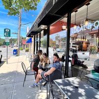 R2R Entrance with visitors from Colorado enjoying the views of Pleasantville NY. Yo! Really lovely small town friendly shopping vibes and a very cool bike shop is close bt. at Root 2 Rise in Pleasantville