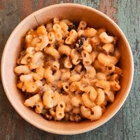 Mac & Cheese: gluten free macaroni elbows, delicious cheese sauce baked with panko breadcrumbs at Root 2 Rise in Pleasantville