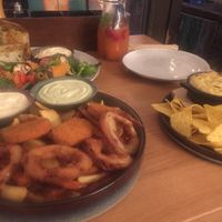 Mix it plate and oven baked cheese with burrito behind at Froindlichst in Berlin