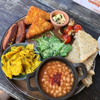 English breakfast with baked beans, hash browns, chickpea omelette   at Froindlichst in Berlin