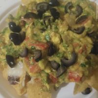 Amazing vegan nachos with cashew cheese and homemade vegan sour cream! at Blessed Life World Foods in Pahoa