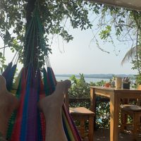 Hammock by by table on the top deckk  at Maracuyá in Flores