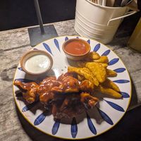 Cauliflower wings and potato wedges at Maracuyá in Flores