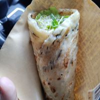 Delicious wrap stuffed with healthy sprouts and greens at Loving Hut 愛家 in Jian