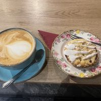 Delicious Oat Milk Latte with Caramel Syrup & a scrumptious Vegan Bakewell 😋😋😋        This cafe is great for vegans , plenty of options, lovely staff very friendly.   at Two Suns Coffee in Marple