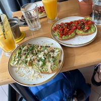 The two different kind of avocado toasts and freshly made orange juice  at Stolia in Shkoder