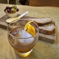 Whiskey cocktail and olives    at Hendersons in Edinburgh