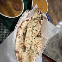 Garlic nan, plant based chicken tikka Masala  at Tulsi Indian Eatery in Los Angeles