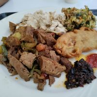 Seitan, tofu, fried berenjena and veggie ball. Def get the complimentary sauce! at Loving Hut in Panama City